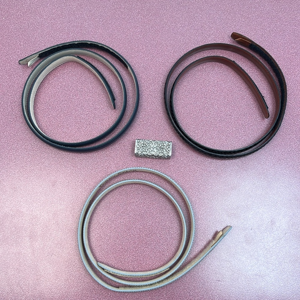 Terry Stack Italian leather skinny belts and buckle. Four piece set.